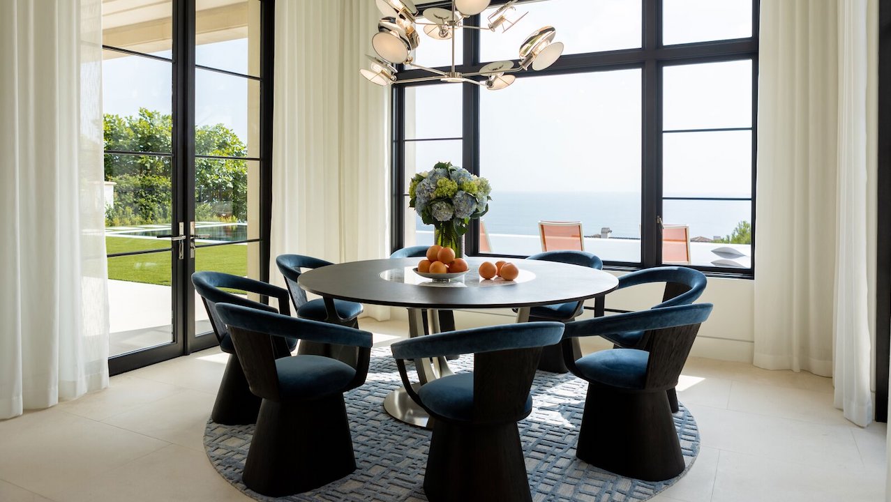 A kitchen area with a custom round table and chairs designed by Xander Noori