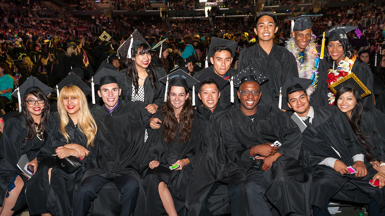 A group photo of smiling FIDM Graduates at graduation