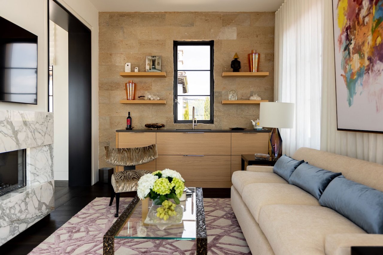 A lounge adjacent to the main bedroom features a fireplace and a bar designed by Xander Noori