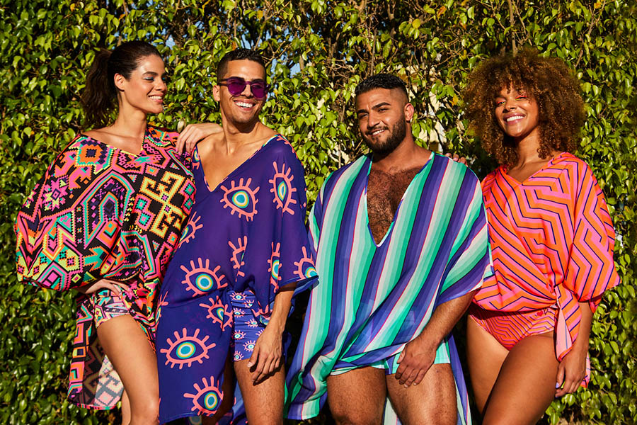 Four people model bright and bold kaftans designed by FIDM Graduate Oday Shakar