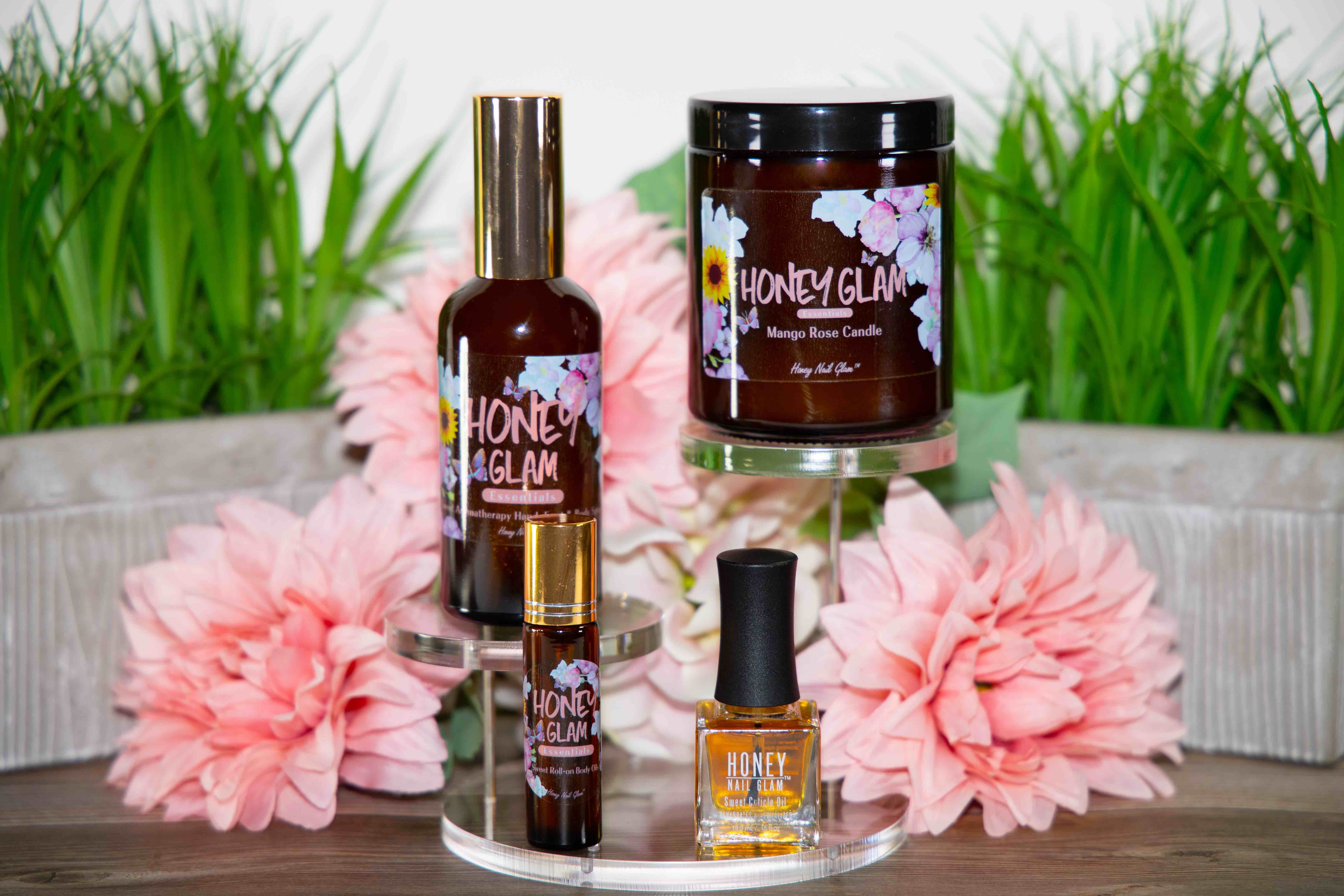 A group of eco-friendly wellness products from Lela Christine's Honey Nail Glam collection