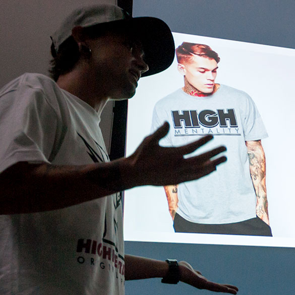 Student presenting graphic T-shirt designs