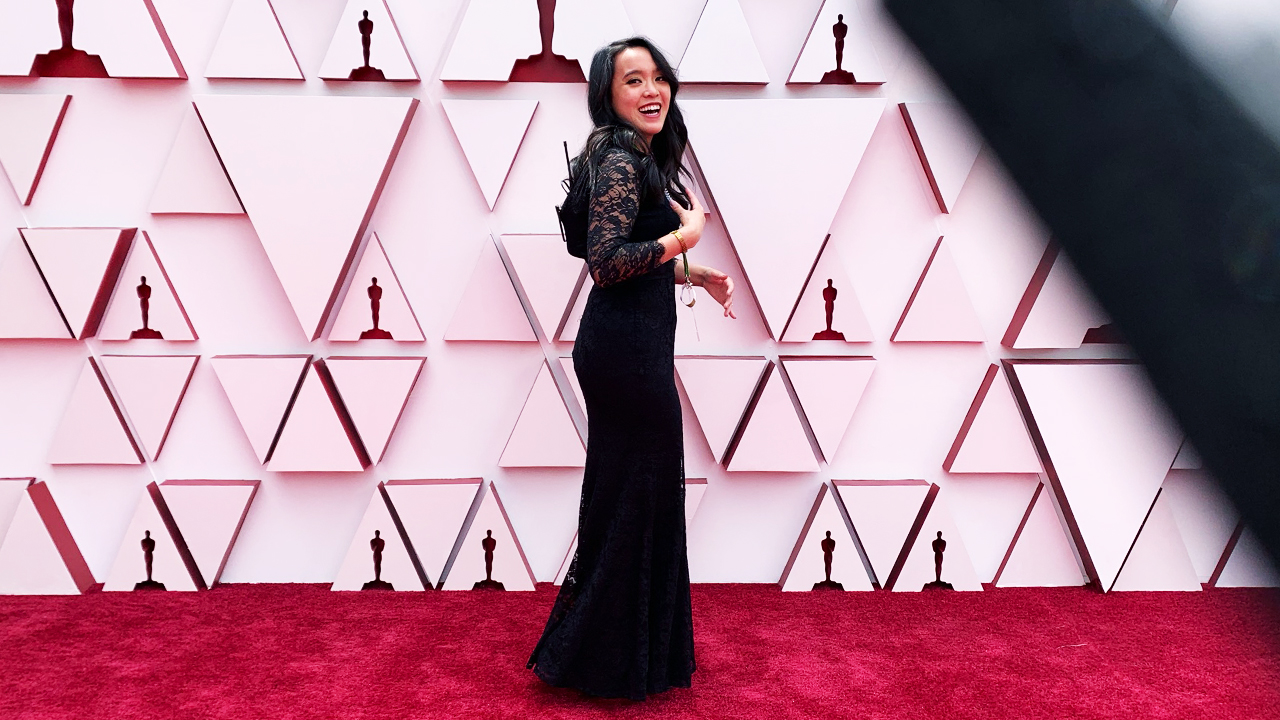 FIDM Graduate Krislam Chin poses on the red carpet at the Oscars
