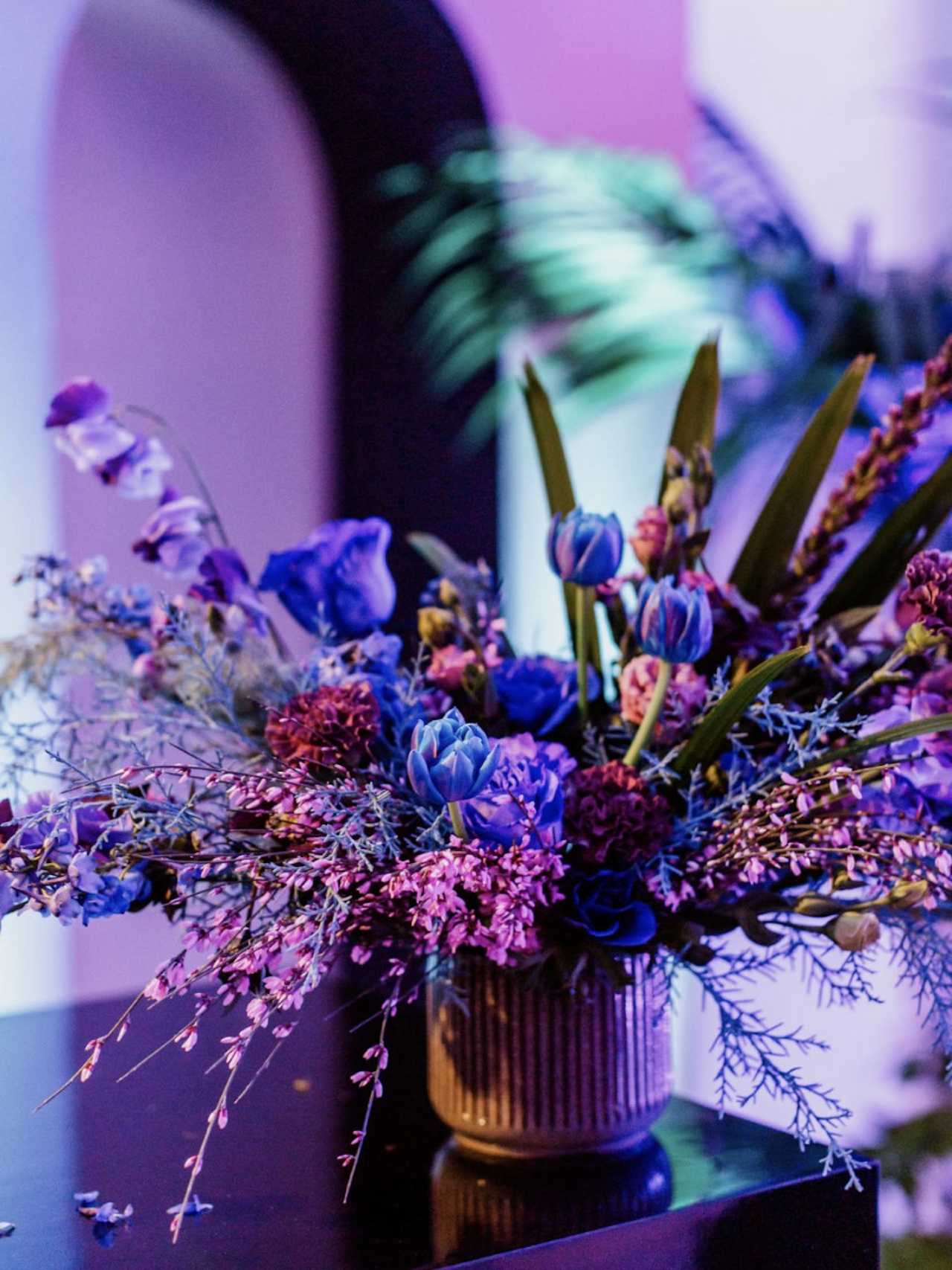 A floral arrangement at an event designed by Susan Houmes