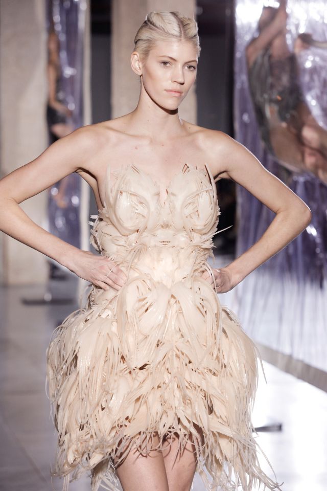 model on the runway wearing a 3-D printed dress by Dutch fashion designer Iris van Herpen