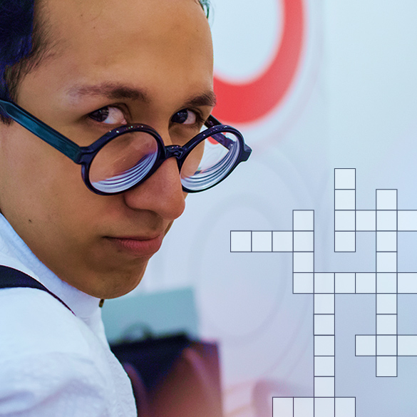 Student with glasses with a crossword puzzle overlay