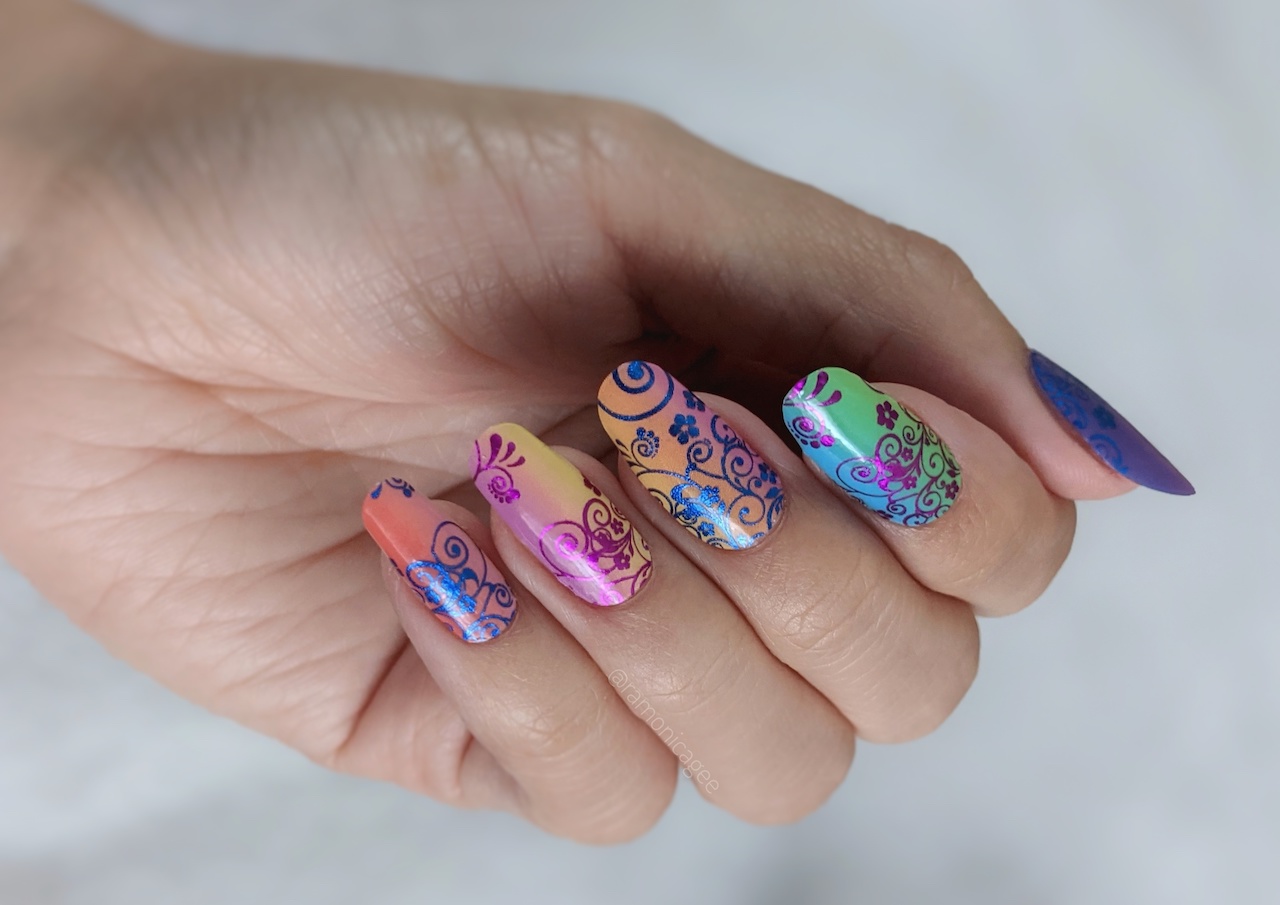 A close up of multicolor nail wrap designs by FIDM Grad Ramonica Gee