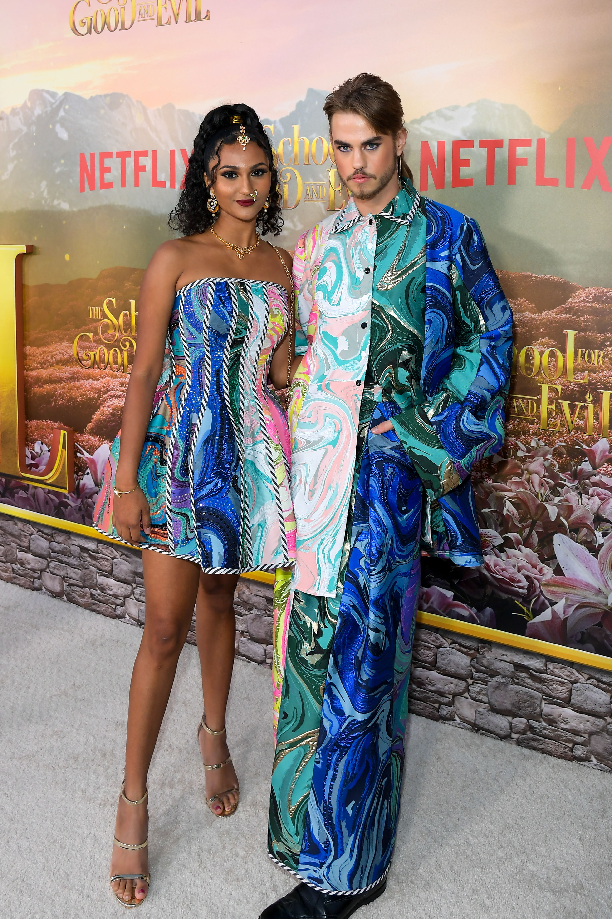 Ethan Martin on the red carpet with influencer Raasi Bommu of Netflix premiere of The School For Good and Evil