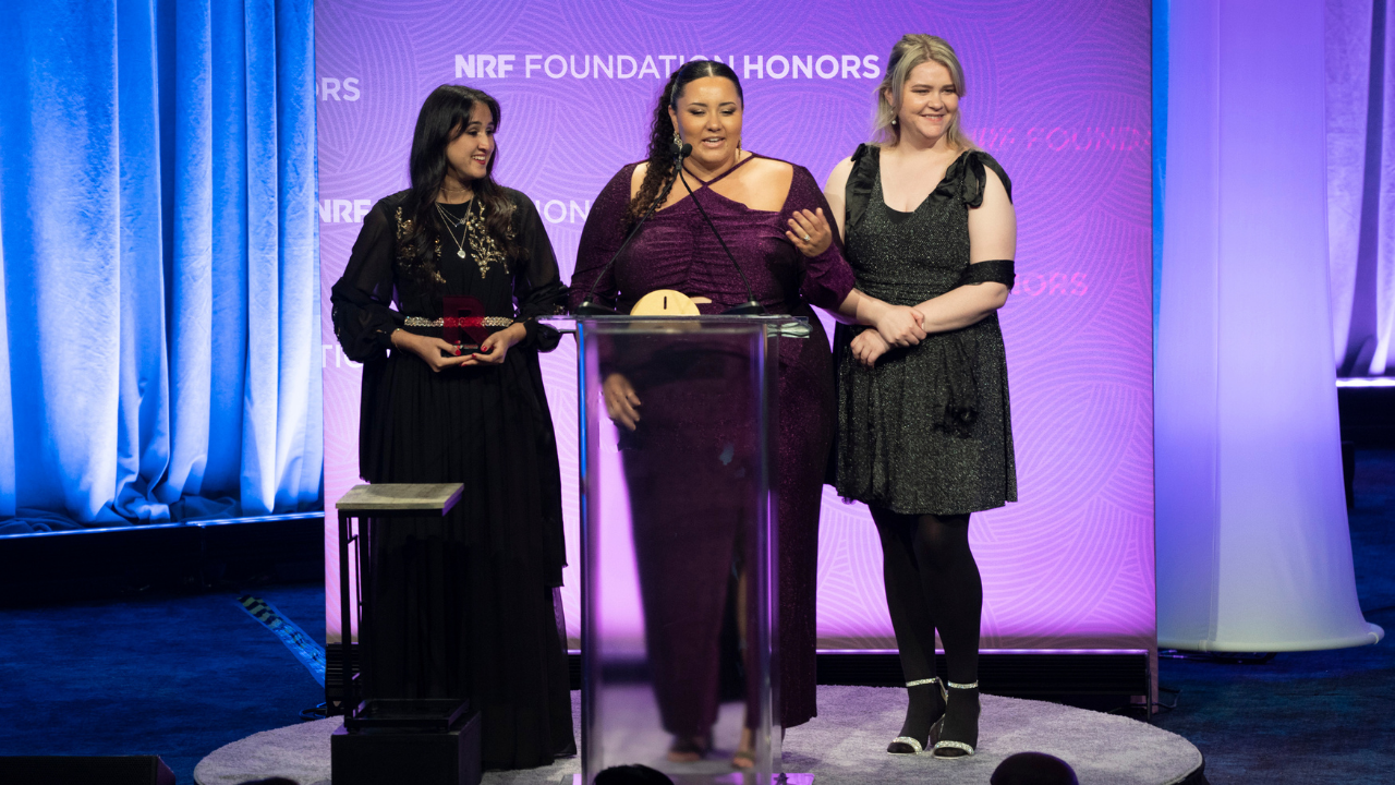FIDM NRF Foundation Student Challenge Team stands at the podium at the awards ceremony in New York